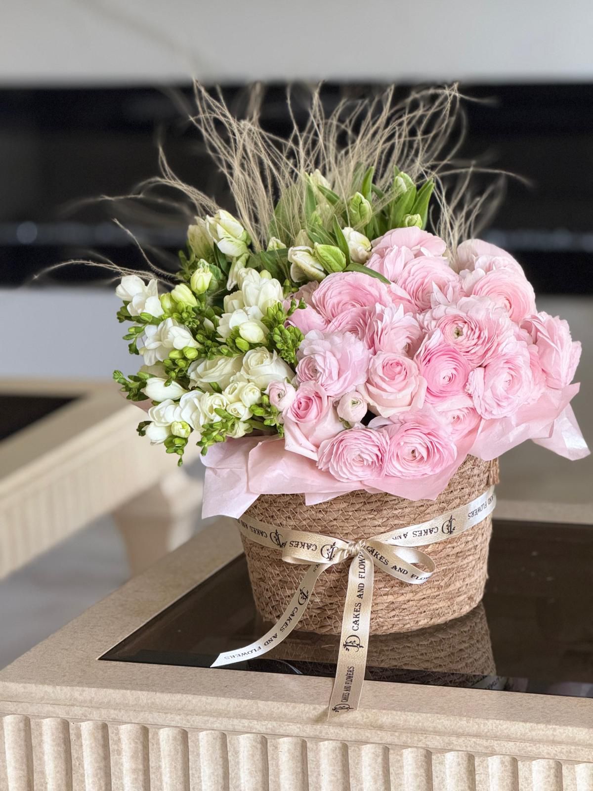 Basket with Ranunculus and Tulips
